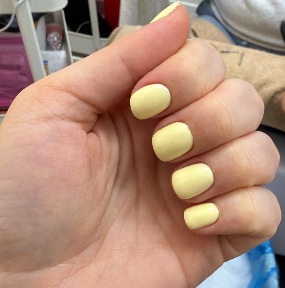 Glazed donut chrome almond acrylic extensions held delicately with soft natural studio daylight